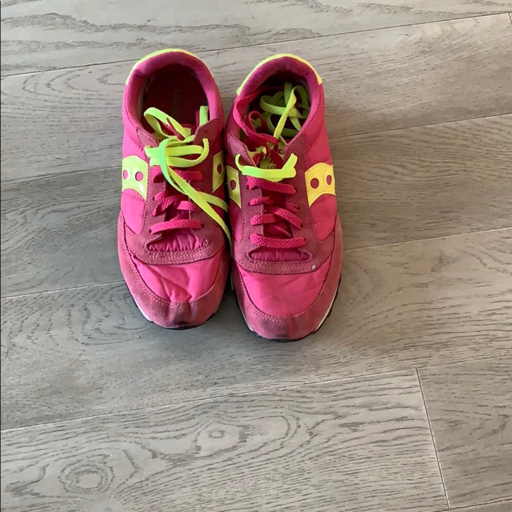 Bright pink and yellow Saucony sneakers